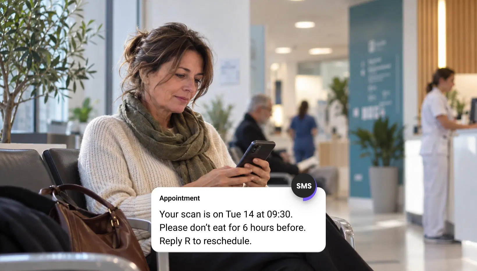 Dental receptionist answering a patient's text in the messaging inbox