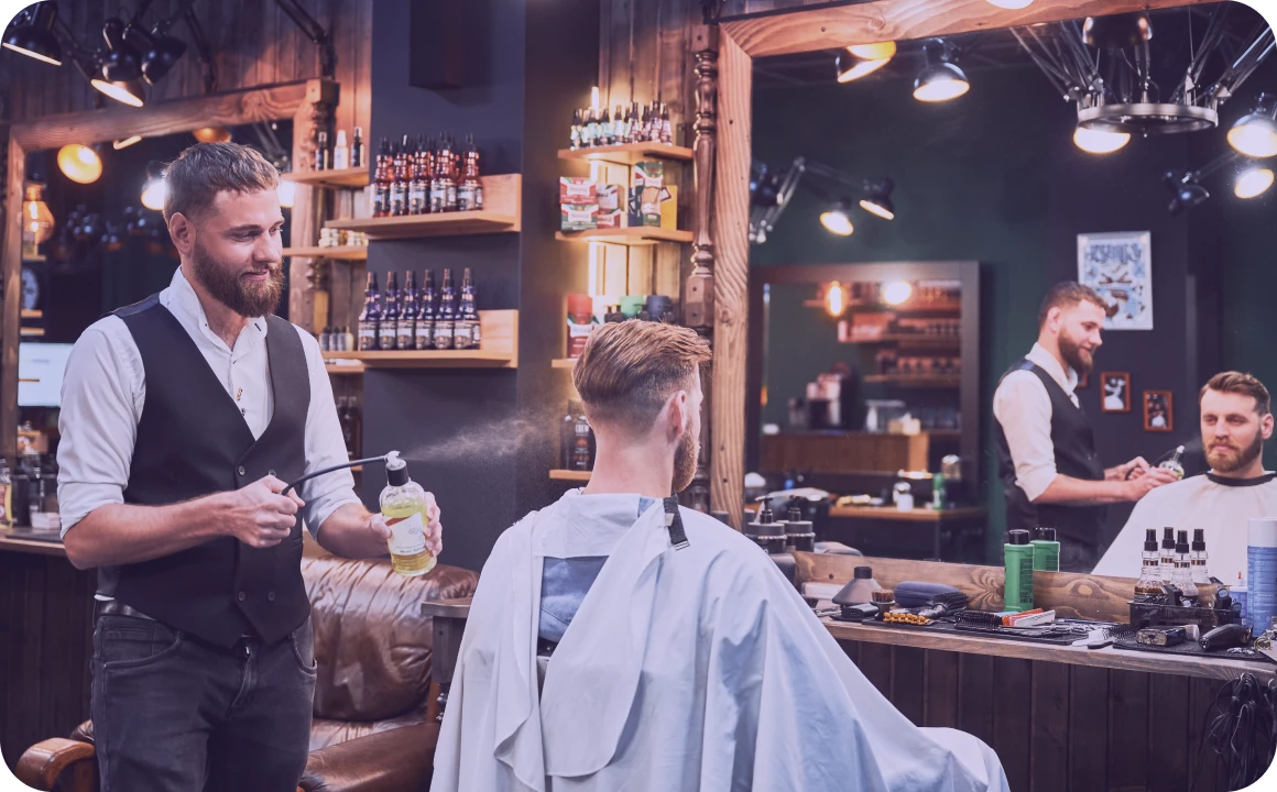 Happy client getting a haircut at a beauty salon