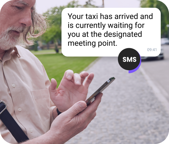 TopMessage AI SMS notification showing taxi arrival details on a mobile device.