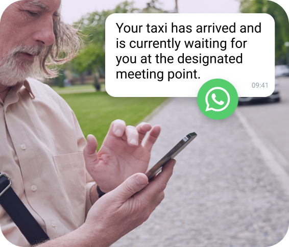 TopMessage AI WhatsApp notification showing taxi arrival details on a mobile device.