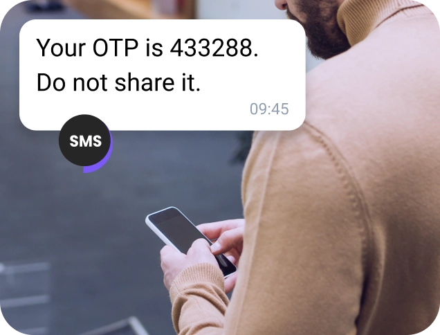 Elderly man in the snow checking his mobile for location via WhatsApp business message