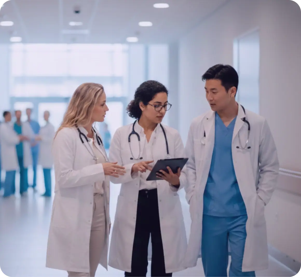 Doctors in a hospital discussing patient care and work plans together.